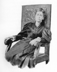 woman seated in a chair