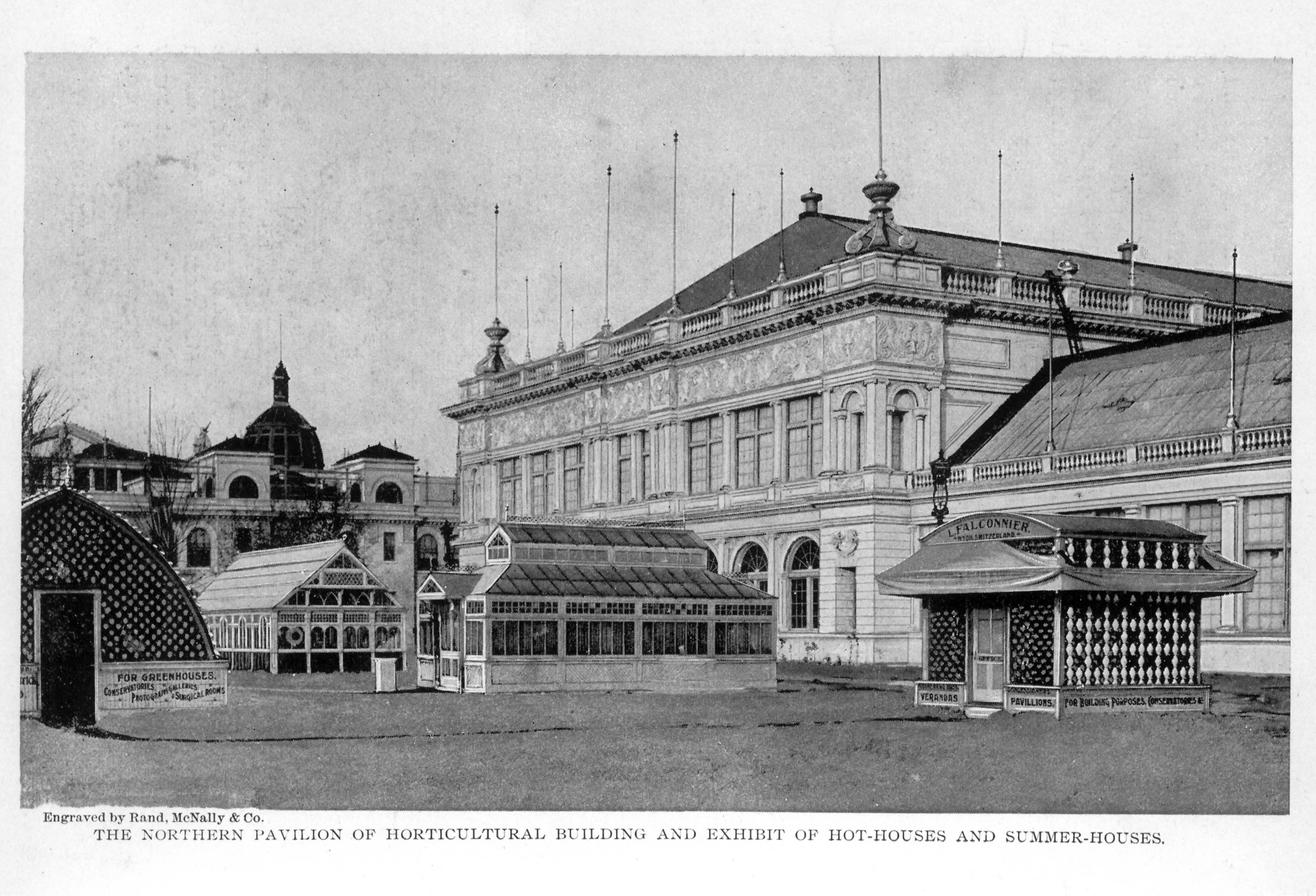large ornate building surrounded by several greenhouses