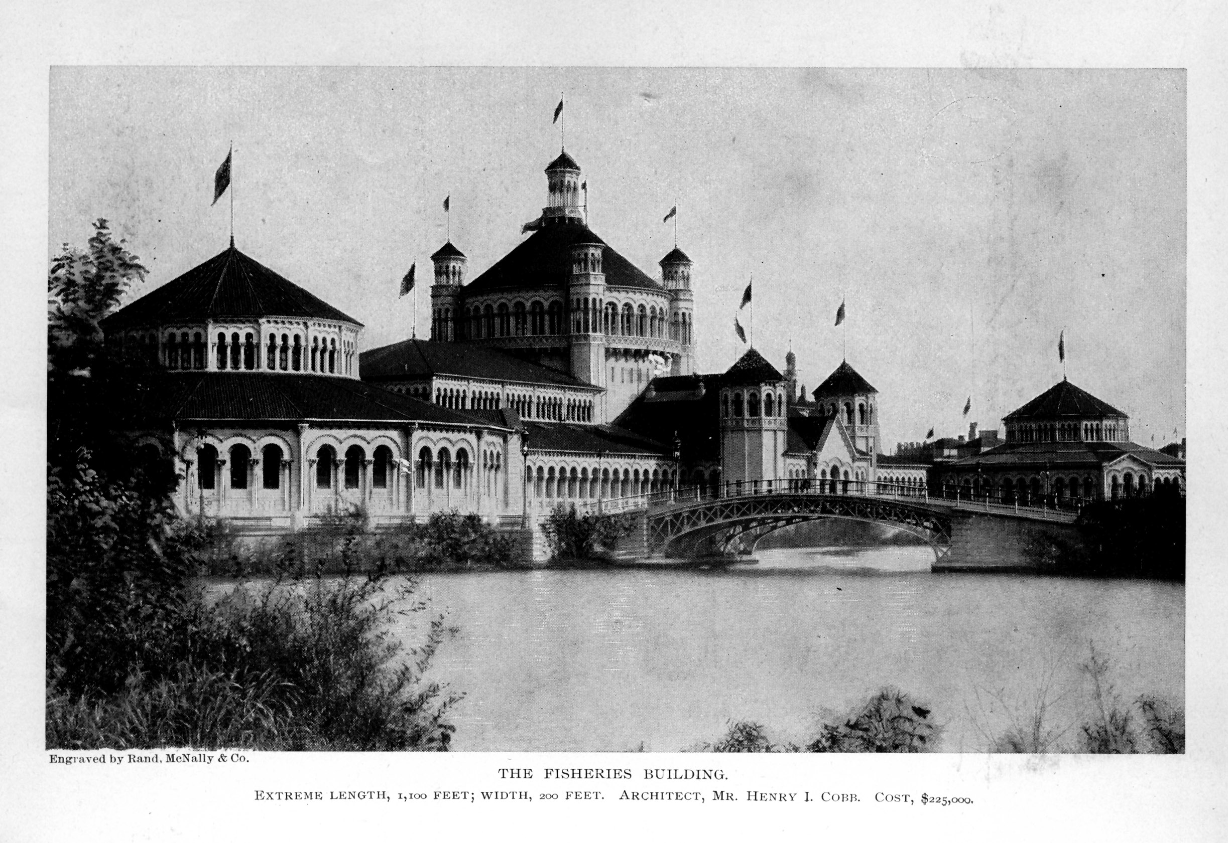 large building with several towers and circular wings built on waterfront