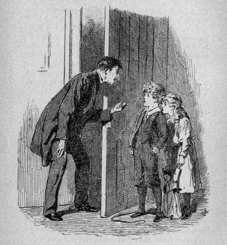 Man scolding two children.