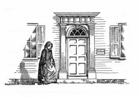A woman stands outside a closed door