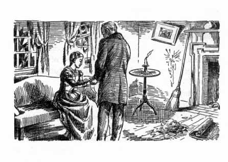 A standing man holds the hand of a woman sitting before him