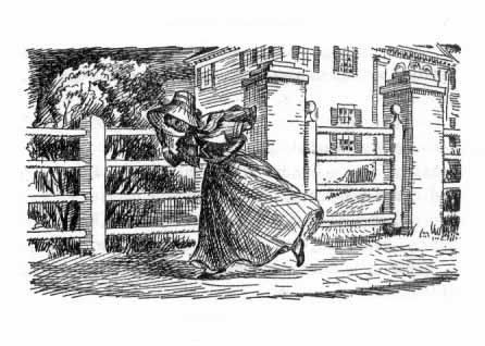 African American woman in a long dress walking along a street, holding her bonnet against the wind